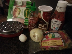 picture of ground turkey, bread crumbs, sriracha, ketchup, egg, onion and chopped bell peppers